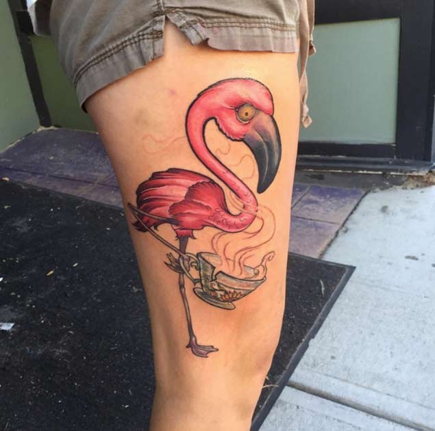 Awesome 3D like pink colored flamingo tattoo on thigh combined with broken cup