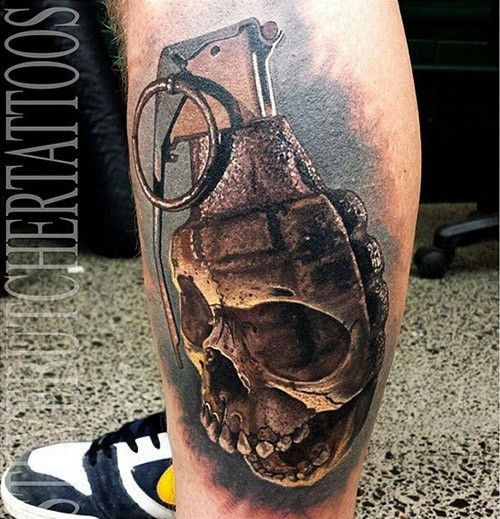 Awesome 3D natural looking grenade tattoo on leg stylized with corrupted skull