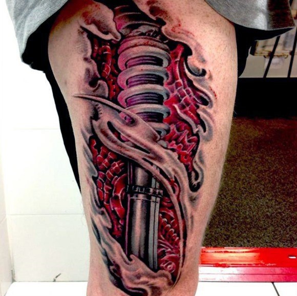 Awesome 3D technique biomechanical parts in torn skin colored detailed thigh tattoo