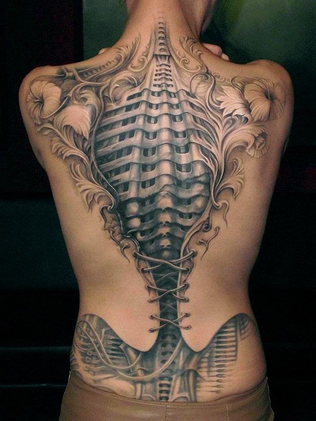 Awesome anatomical corset tattoo on back