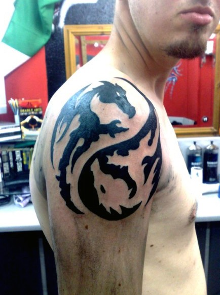 Awesome Asian style black and white dragons Yin Yang symbol shaped arm top tattoo