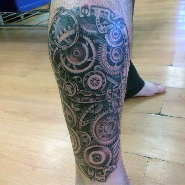 Awesome biomechanical tattoo with different details and mechanisms on leg