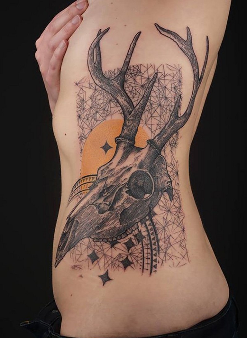 Awesome black and white big detailed animal skull with ornaments tattoo on side