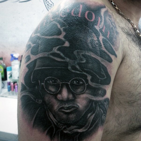 Awesome black ink soldier upper arm tattoo with lettering