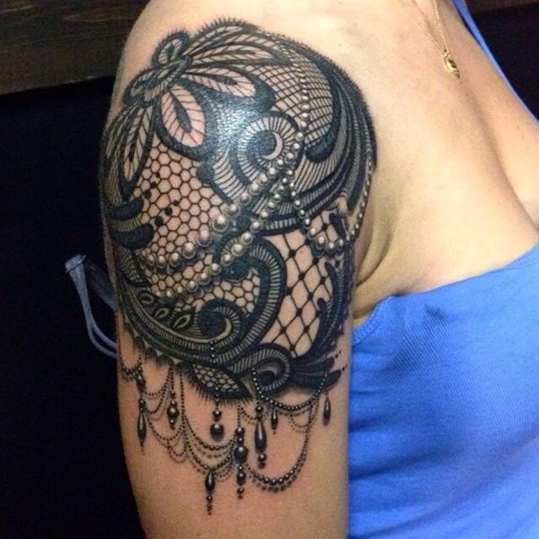 Awesome black ink very realistic shoulder armor tattoo