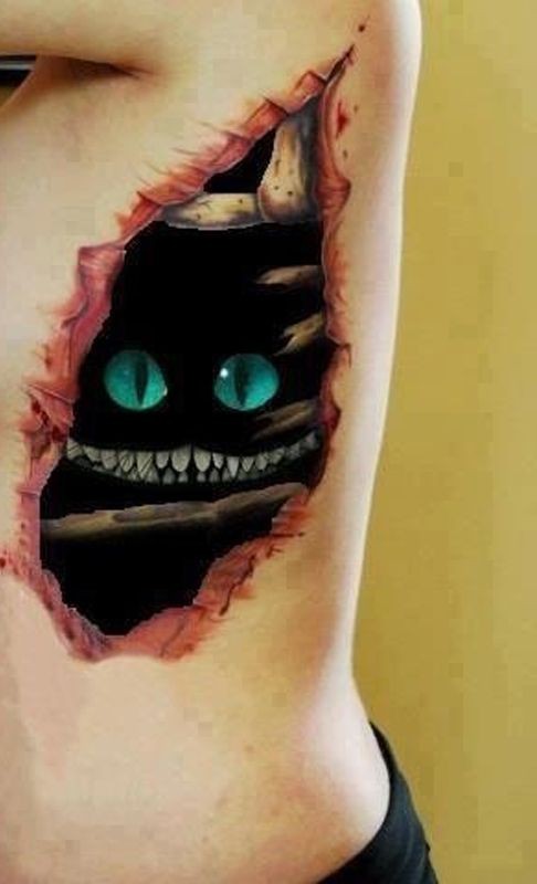 Awesome cheshire cat skin rip tattoo on ribs