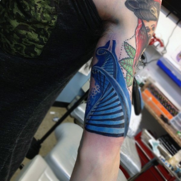 Awesome colored DNA shaped stairs tattoo on arm