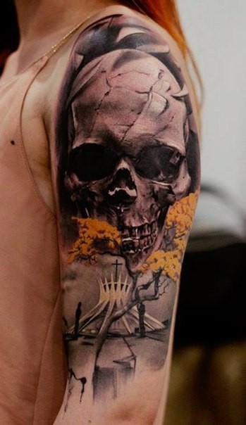 Awesome colored shoulder tattoo of human skull with strange church