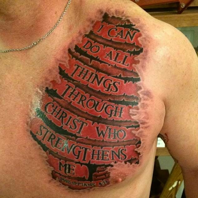 Awesome colored under skin religious banner lettering tattoo on chest
