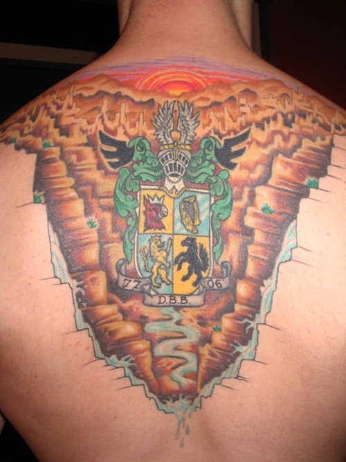 Awesome coloured family crest tattoo on back