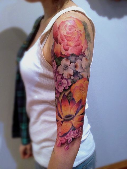 Awesome coloured flowers tattoo on half sleeve