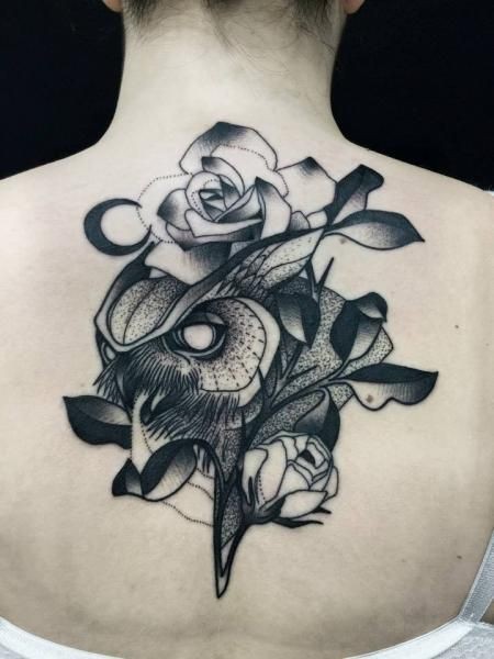Awesome combined by Michele Zingales upper back tattoo of owl head with roses