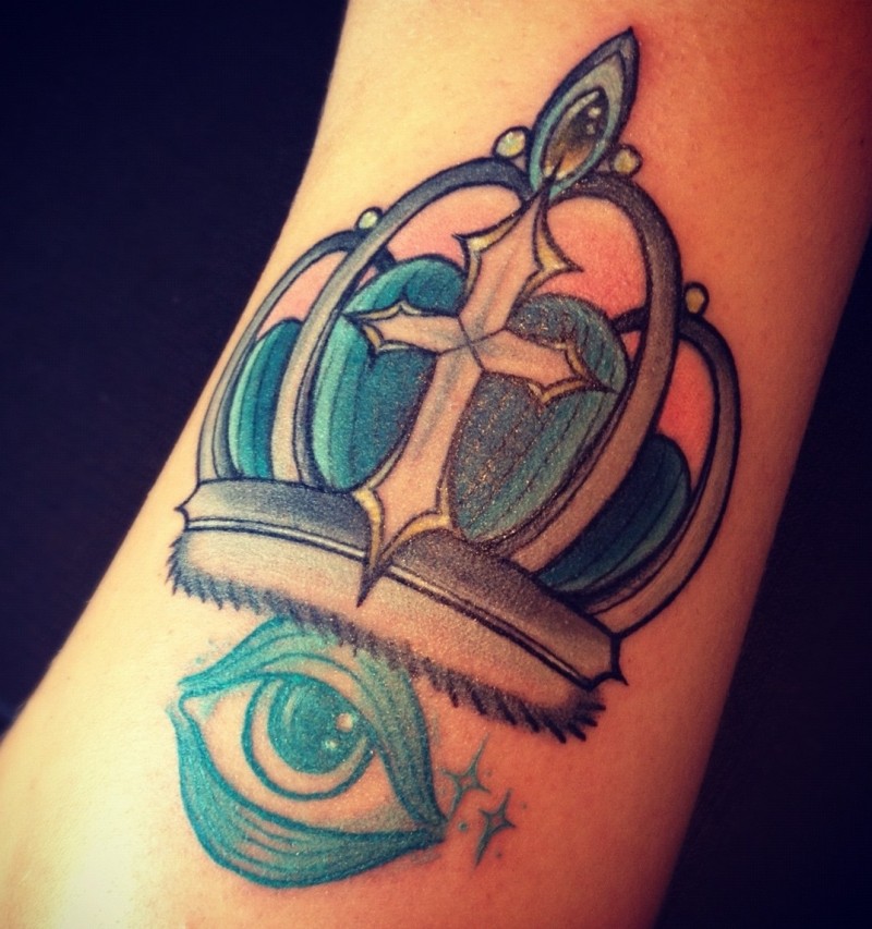 Awesome crown tattoo with blue eye