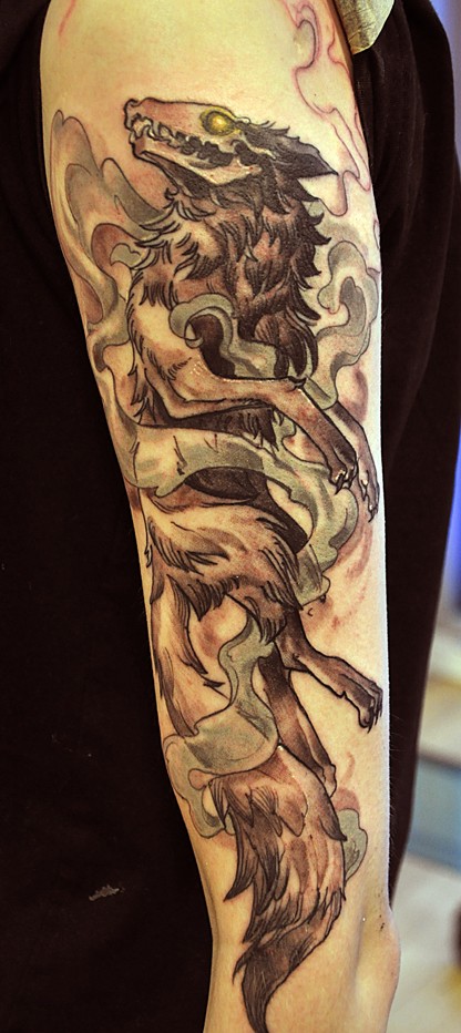 Awesome dead wolf tattoo on half sleeve