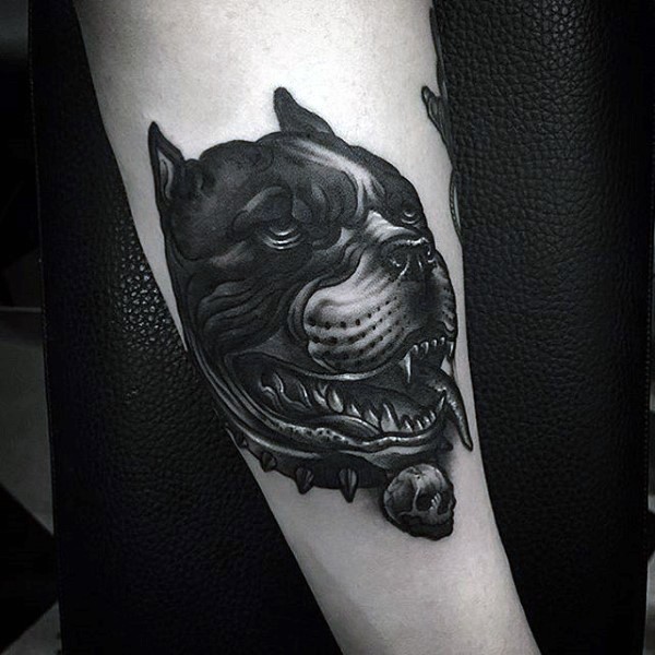 Awesome designed and detailed black ink evil dog with skull tattoo on arm
