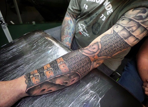Awesome designed and detailed colored medieval armor tattoo on sleeve