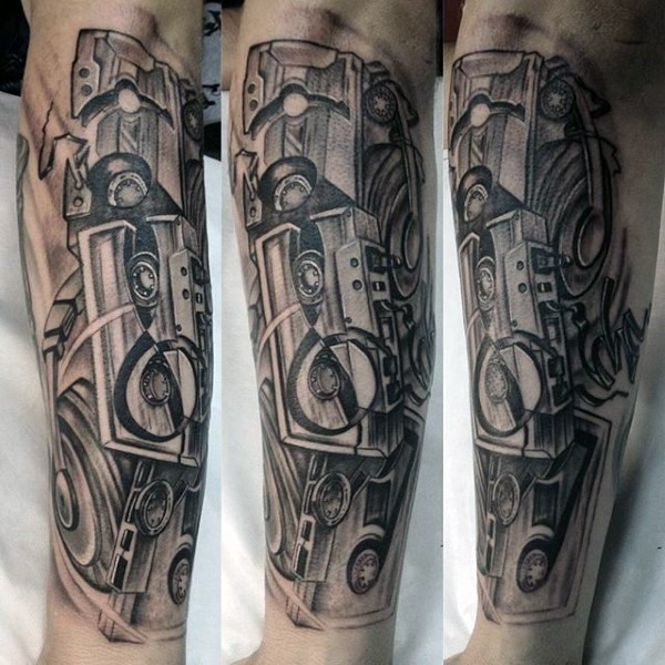 Awesome designed black and white old broken tapes tattoo on arm