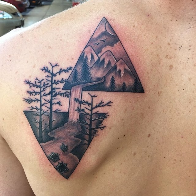 Awesome designed black ink triangle shaped shoulder tattoo stylized with mountain river and forest