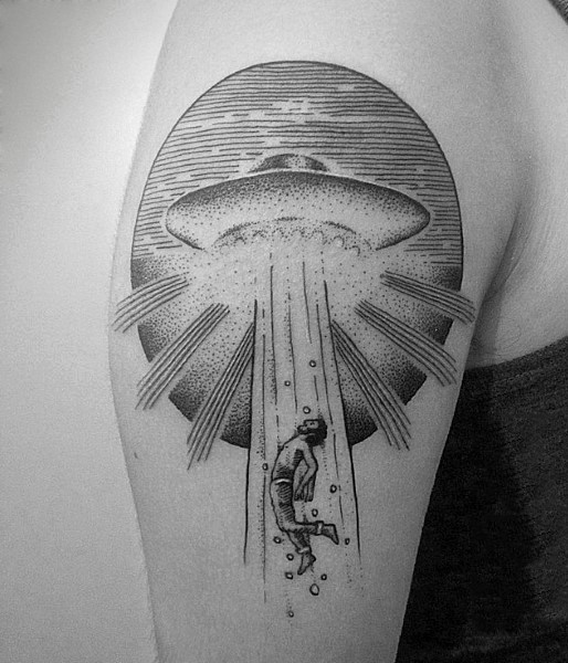 Awesome designed simple painted black ink alien ship with human shoulder tattoo
