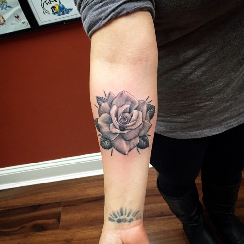 Awesome gray-ink rose flower tattoo on forearm