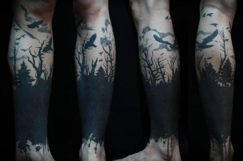 Awesome little black ink dark forest with crows tattoo on ankle