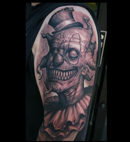 Awesome monster clown tattoo on arm