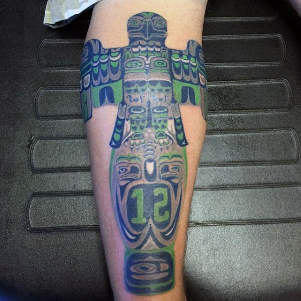 Awesome multicolored tribal tattoo on leg