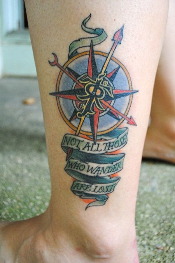 Awesome nautical themed colorful compass tattoo on ankle stylized with lettering