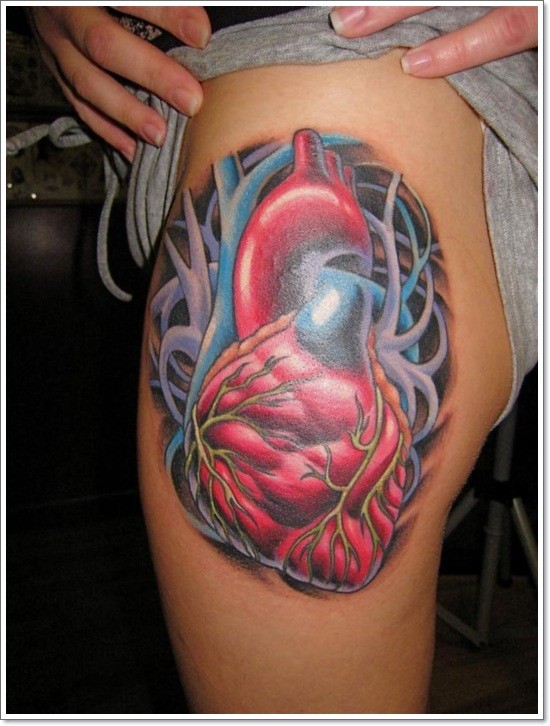 Awesome new school heart tattoo on thigh