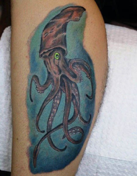 Awesome painted and colored little squid tattoo on leg