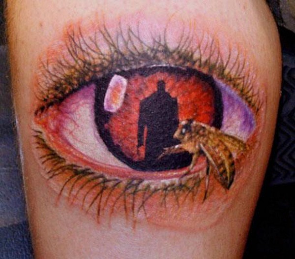 Awesome painted big colored mystical eye with bee tattoo on leg