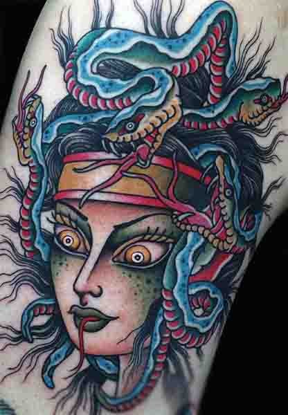 Awesome painted multicolored evil medusa head tattoo on arm