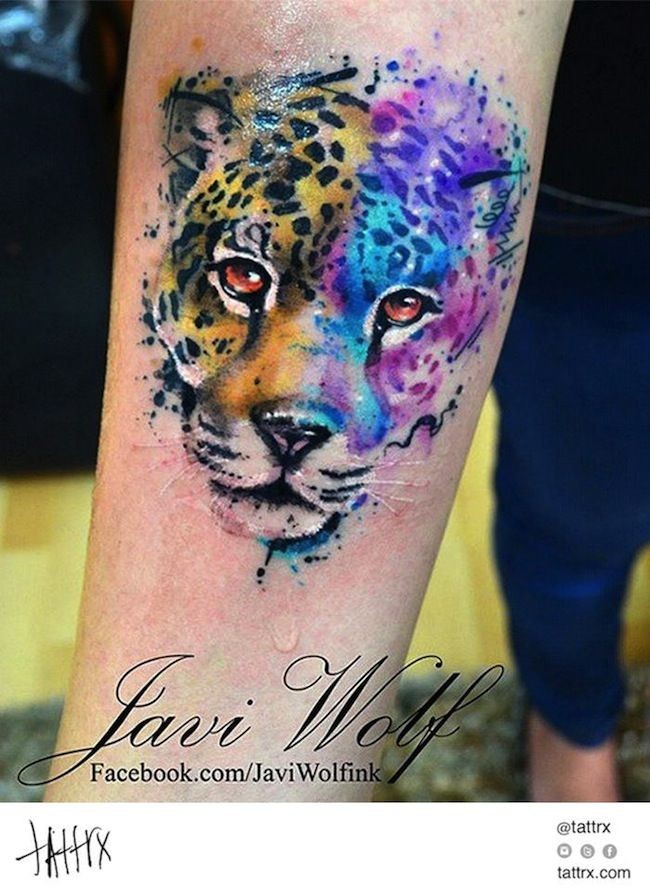 Awesome panther portrait colored tattoo on forearm by Javi Wolf in watercolor style