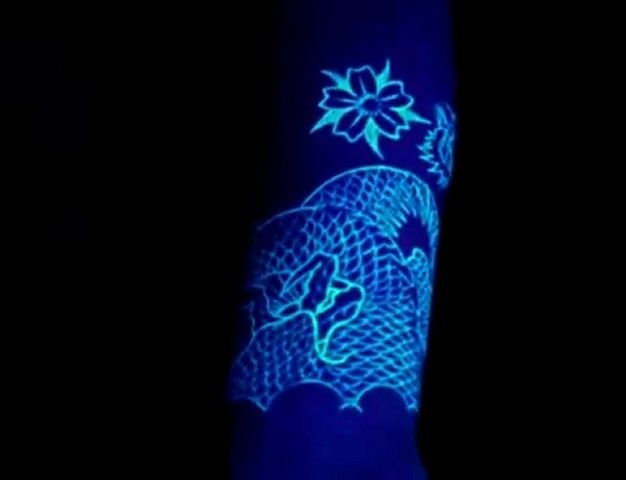 Awesome patterns and flowers black light style tattoo