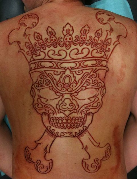 Awesome skin scarification skull with crown