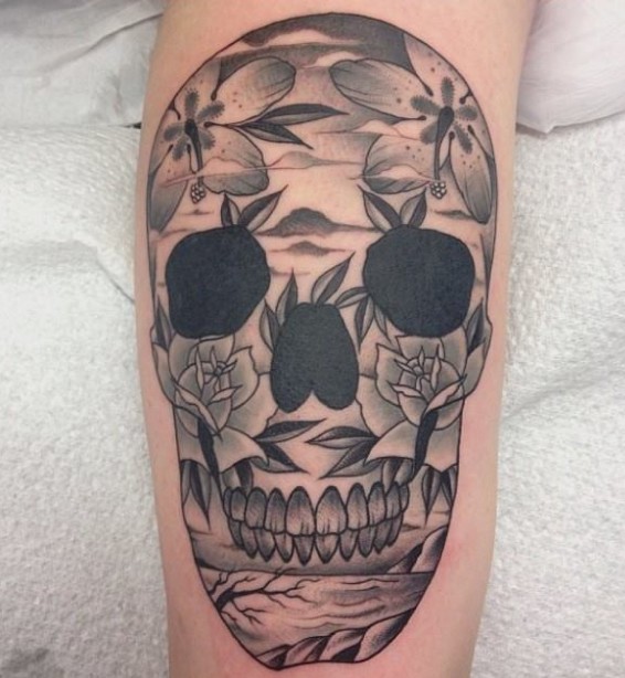 Awesome skull with flowers tattoo