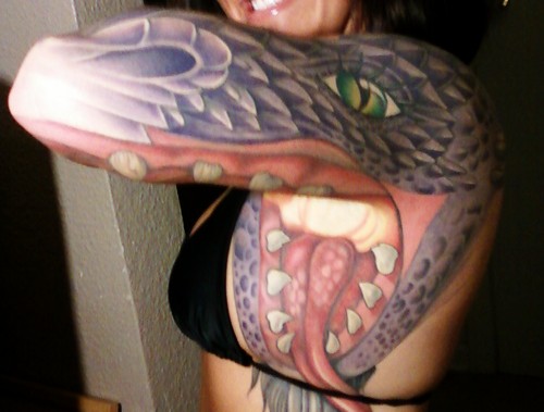 Awesome snake head tattoo on arm