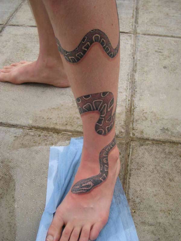 Awesome snake wrapped around leg tattoo