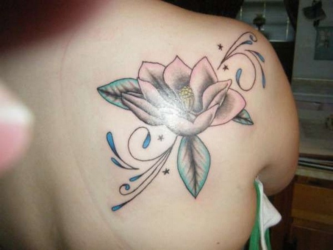 Awesome white magnolia flower tattoo on back