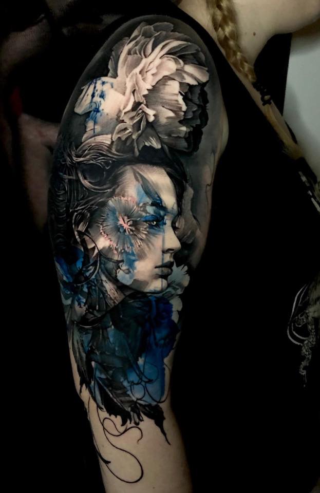 Awesome woman head tattoo on shoulder in black white and blue colors