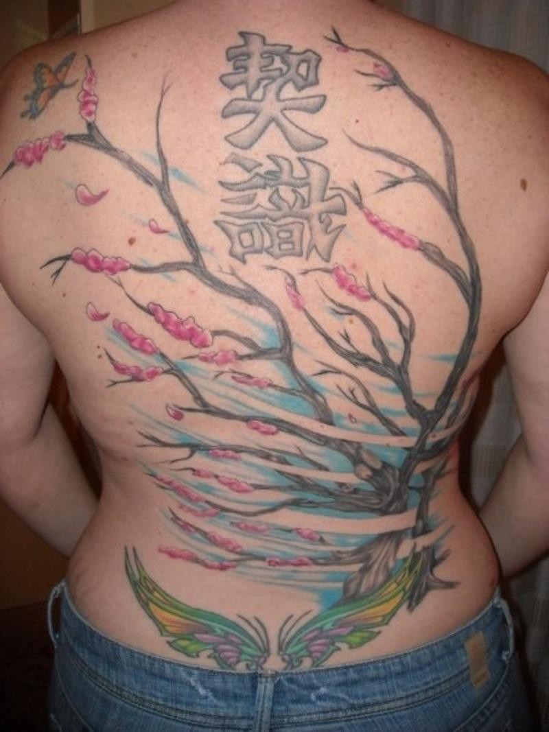 Back tattoo with chinese tree and symbols