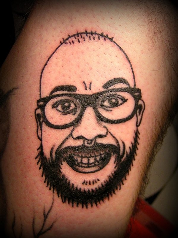 Bald smiling nerd in glasses with beard funny detailed tattoo