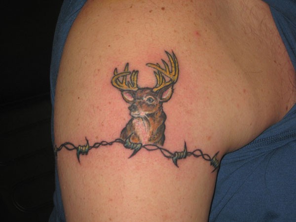 Barbed wire with deer head tattoo