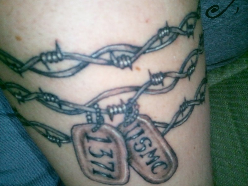 Barbed wire with dog tags tattoo