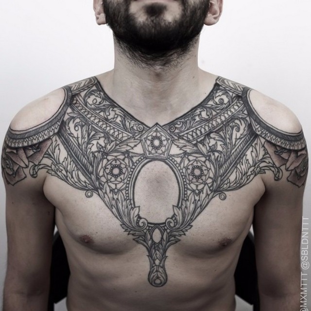 Baroque style black ink detailed big tattoo on chest and shoulders