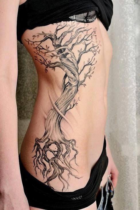 Beautiful black and gray tree tattoo on ribs