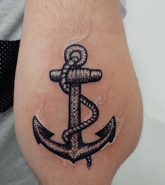 Beautiful black and white anchor tattoo on arm