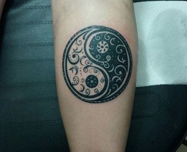Beautiful black ink leg tattoo of Yin Yang symbol