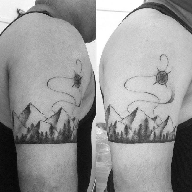 Linda tatuagem braço de tinta preta de montanhas com floresta