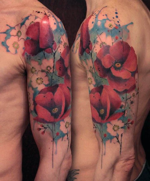Beautiful colored big natural flowers tattoo on sleeve